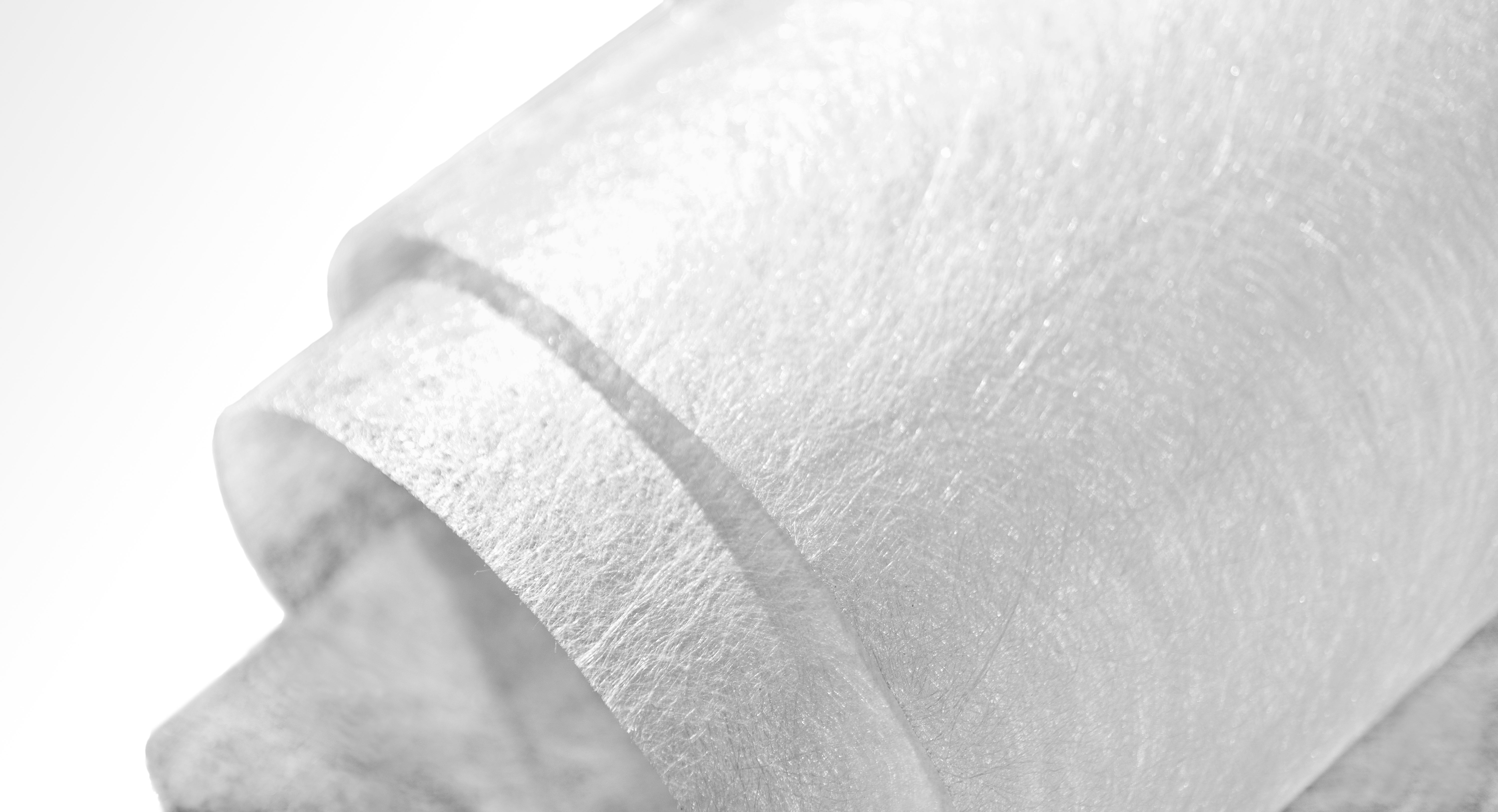 Bi-component coarse denier filament nonwoven material